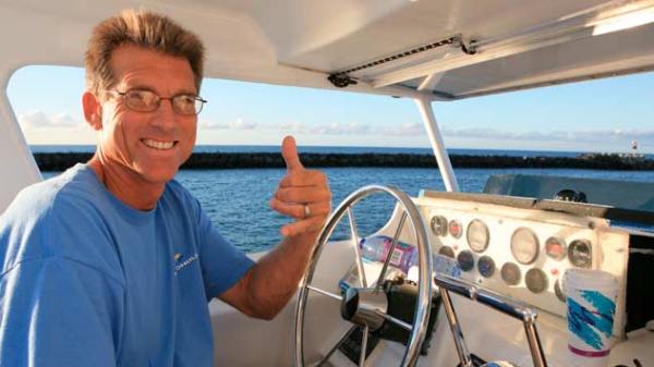 The captain throwing up the shaka