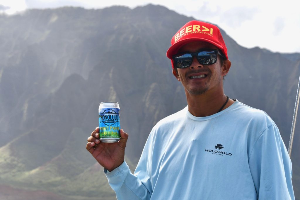 a man standing in front of a mountain