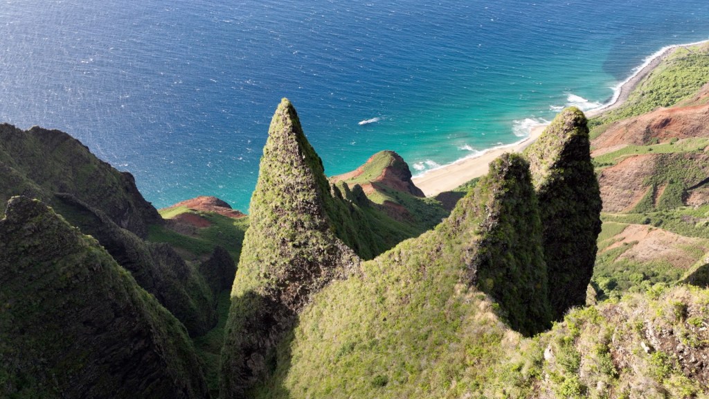 a rocky island in the middle of a body of water